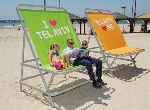 Relaxing on the beach   Photo: Kfir Sivan